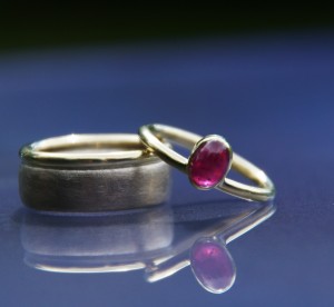 white and yellow gold wedding band with combination ruby ring