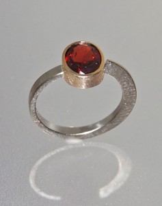 garnet ring with white and yellow gold