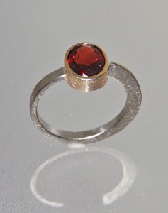 garnet ring with white and yellow gold