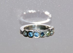 silver ring with multicoloured sapphires
