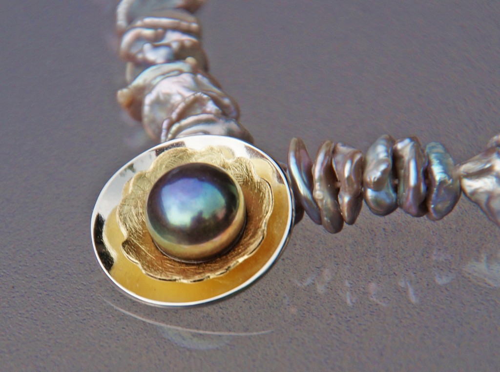 gold and silver pendant with dark freshwater bouton pearl