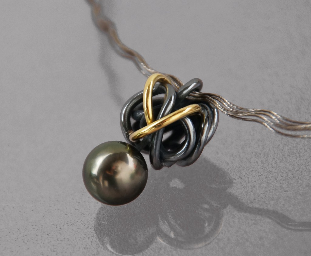 tahiti pearl pendant with gold and oxidized silver 